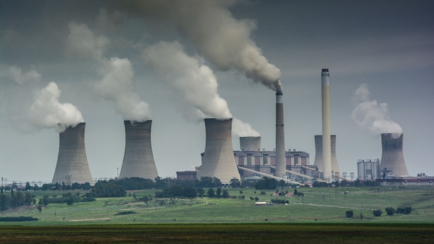 Emissions rise from the cooling towers of the Eskom Holdings SOC Ltd. Matla coal-fired power station in Mpumalanga, South Africa, on Monday, Dec. 23, 2019. The level of sulfur dioxide emissions in the Kriel area in Mpumalanga province only lags the Norilsk Nickel metal complex in the Russian town of Norilsk, the environmental group Greenpeace said in a statement, citing 2018 data from NASA satellites. Photographer: Waldo Swiegers/Bloomberg