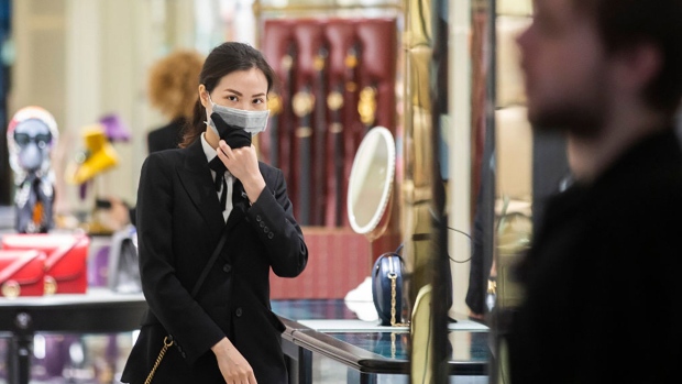 Shop assistants in luxury outlets in Sydney's CBD are seen wearing masks on January 31, 2020 in Sydney, Australia. 