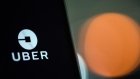 An Uber Technologies Inc. logo sits on a smartphone display in this arranged photograph in London, U.K., on Friday, Dec. 22, 2017. Uber will be regulated in European Union countries as a transport company after the bloc's top court rejected its claim to be a digital service provider, a decision that could increase legal risks for other gig-economy companies including Airbnb. Photographer: Chris J. Ratcliffe/Bloomberg