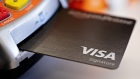 A Visa Inc. credit card is arranged for a photograph in Tiskilwa, Illinois. Bloomberg