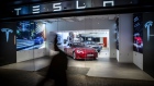 Electric automobiles are displayed inside a Tesla store in Barcelona. Photographer: Angel Garcia/Bloomberg