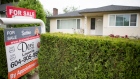 A real estate sign is pictured in Vancouver, B.C., Tuesday, June 12, 2018.