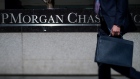 Pedestrians pass in front of the JPMorgan Chase & Co. headquarters in New York. Photographer: Scott Eells/Bloomberg