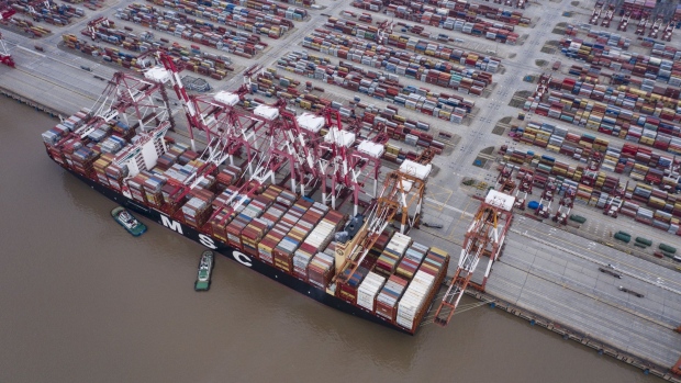 A Mediterranean Shipping Co. (MSC) container ship is moored at the Yangshan Deep Water Port in this aerial photograph taken in Shanghai, China, on Tuesday, Feb. 4, 2020. Chinese officials are hoping the U.S. will agree to some flexibility on pledges in their phase-one trade deal, people familiar with the situation said, as Beijing tries to contain a health crisis that threatens to slow domestic growth with repercussions around the world. Photographer: Qilai Shen/Bloomberg