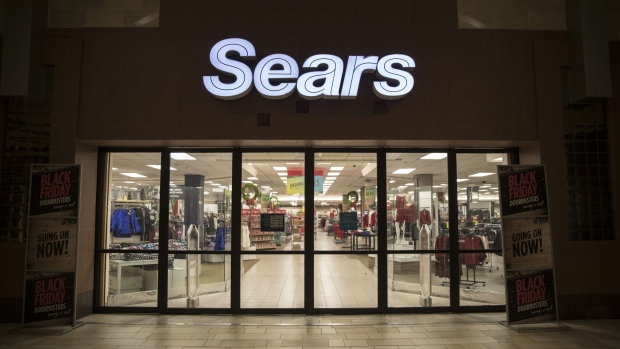 Entrance doors stand locked before opening hours at a Sears Holdings Corp. store on Black Friday at the Newport Centre Mall in Jersey City, New Jersey, U.S., on Friday, Nov. 23, 2018. With the U.S. economy strong, forecasts are signaling massive sales from Thanksgiving to Cyber Monday, and early signs say those rosy outlooks are spot on. Photographer: Victor J. Blue/Bloomberg