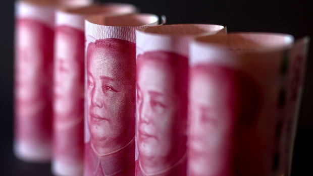 Chinese one-hundred yuan banknotes are arranged for a photograph in Hong Kong, China, on Monday, April 15, 2019. China's holdings of Treasury securities rose for a third month as the Asian nation took on more U.S. government debt amid the trade war between the world’s two biggest economies. Photographer: Paul Yeung/Bloomberg