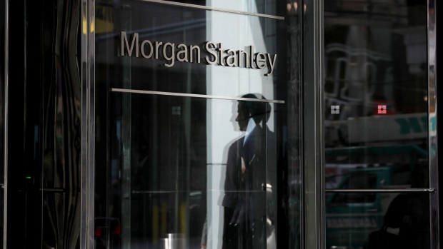 A pedestrian is reflected on the exterior of Morgan Stanley headquarters in New York. Photographer: Bess Adler/Bloomberg