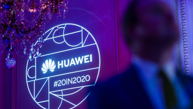 A Huawei Technologies Co. logo is projected on a wall during the company's Chinese New Year celebration in Brussels, Belgium, on Tuesday, Feb. 4, 2020. Huawei Technologies Co. is in talks about investing in European tech startups and contributing to research in a bid to secure its supply chain as tensions with the U.S. escalate, people familiar with the matter said. Photographer: Geert Vanden Wijngaert/Bloomberg