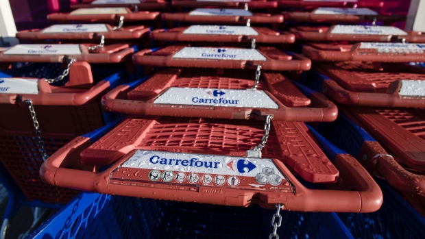 Shopping carts outside a Carrefour supermarket. Photographer: Marlene Awaad/Bloomberg