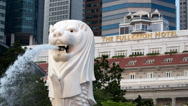 The Merlion statue stands at the Marina Bay waterfront as the Fullerton Hotel stands in the background in Singapore, on Sunday, June 10, 2018. U.S. President Donald Trump and North Korean leader Kim Jong Un will hold their historic Singapore summit at the Capella Hotel on the city-states Sentosa Island on June 12. Photographer: SeongJoon Cho/Bloomberg