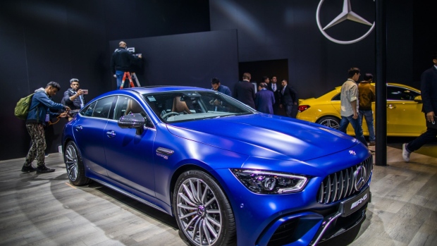Members of the media look at a Mercedes-Benz AG AMG vehicle on display at the Auto Expo 2020 in Noida, Uttar Pradesh, India, on Wednesday, Feb. 5, 2020. The motor show opens to the public on Feb. 7 and runs through Feb. 12. Photographer: Prashanth Vishwanathan/Bloomberg