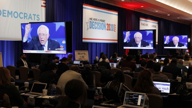 Senator Bernie Sanders, an Independent from Vermont and 2020 presidential candidate, is seen on television screens in the spin room during the Democratic presidential candidate debate in Las Vegas, Nevada, U.S., on Wednesday, Feb. 19, 2020. Beneath all of the sparring between candidates leading up to the debate is a broader strategic question that Democrats must address: Whether the best way to beat President Donald Trump in November is by reassuring moderates with kitchen-table proposals or by bolstering turnout with aggressive ideas that create a clear contrast. Photographer: Joe Buglewicz/Bloomberg