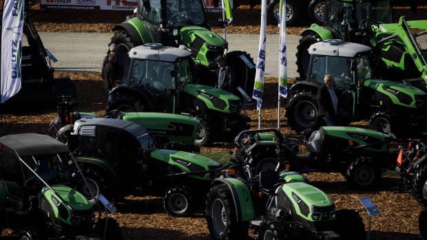 Attendees browse Same Deutz-Fahr Schweiz AG tractors during the World Agriculture Expo in Tulare, California, U.S., on Wednesday, Feb. 12, 2020. The annual World AG Expo has more than 1,450 exhibitors displaying the latest in farm equipment, chemicals, communications, and technology. Photographer: Patrick T. Fallon/Bloomberg