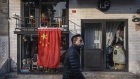 BEIJING, CHINA - FEBRUARY 19: A Chinese man wears a protective mask as he walks by a closed business on February 19, 2020 in Beijing, China. The number of cases of the deadly new coronavirus COVID-19 rose to more than 58000 in mainland China Wednesday, in what the World Health Organization (WHO) has declared a global public health emergency. China continued to lock down the city of Wuhan in an effort to contain the spread of the pneumonia-like disease which medicals experts have confirmed can be passed from human to human. In an unprecedented move, Chinese authorities have maintained and in some cases tightened the travel restrictions on the city which is the epicentre of the virus and also in municipalities in other parts of the country affecting tens of millions of people. The number of those who have died from the virus in China climbed to over 2000 on Wednesday mostly in Hubei province, and cases have been reported in other countries including the United States, Canada, Australia, Japan, South Korea, India, the United Kingdom, Germany, France and several others. The World Health Organization has warned all governments to be on alert and screening has been stepped up at airports around the world. Some countries, including the United States, have put restrictions on Chinese travellers entering and advised their citizens against travel to China. (Photo by Kevin Frayer/Getty Images)