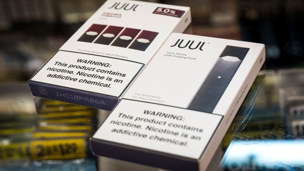 Packages of Juul Labs Inc. device kit and Virginia Tobacco pods are arranged for a photograph at a store in San Francisco, California, U.S., on Wednesday, June 26, 2019. The city voted Tuesday to ban sales of e-cigarettes, making it illegal to sell nicotine vaporizer products in stores or for online retailers to ship the goods to San Francisco addresses. Photographer: David Paul Morris/Bloomberg