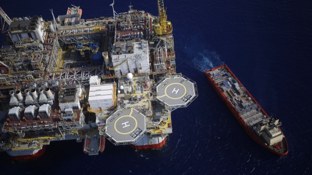 The Kobe Chouest platform supply vessel sits anchored next to the Chevron Corp. Jack/St. Malo deepwater oil platform in the Gulf of Mexico in the aerial photograph taken off the coast of Louisiana. Photographer: Luke Sharrett/Bloomberg