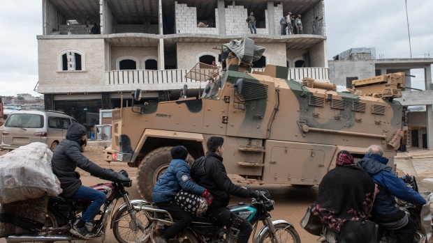 IDLIB, SYRIA - FEBRUARY 22: Turkish Military's armoured vehicles that crossed to Syria drive pass in a road in village of Aaqrabate on February 22, 2020 in Idlib, Syria. Turkey’s President Recep Tayyip Erdogan in a speech Tuesday threatened, “imminent operations in Syria’s Idlib if Damascus fails to withdraw behind Turkish positions” The threat comes after Syria’s government and its ally Russia rejected demands to pull back to ceasefire lines agreed upon in the 2018 Sochi accord. More than 900,000 civilians have been displaced by fighting in or around Idlib since December 1. Idlib is the last rebel stronghold of fighters trying to overthrow Syrian President Bashar al-Assad and in the past years has become the last safe haven for civilians displaced by fighting in other areas of Syria, its population has doubled to close to three million people, many of whom are now fleeing the government offensive towards overcrowded camps close to the Turkish border amid freezing conditions, creating a humanitarian disaster. (Photo by Burak Kara/Getty Images)