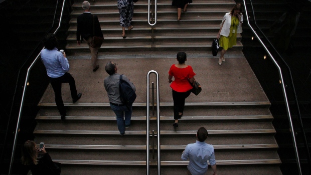 Pedestrians climb a flight of steps at Martin Place in the central business district in Sydney, Australia, on Friday, Jan. 11, 2019. Australian consumer confidence slumped the most in more than three years, amid pessimism over falling property prices and economic growth, after the nation's dollar tumbled to the weakest in almost 10 years at the beginning of the month. Photographer: Lisa Maree Williams/Bloomberg
