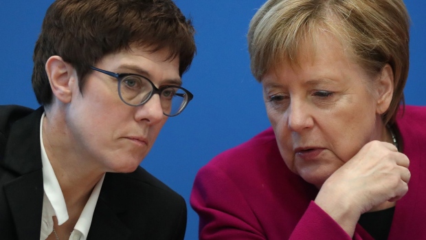 BERLIN, GERMANY - OCTOBER 29: German Chancellor and leader of the German Christian Democrats (CDU) Angela Merkel (R) chats with CDU General Secretary Annegret Kramp-Karrenbauer prior to a meeting of the CDU leadership the day after elections in the state of Hesse on October 29, 2018 in Berlin, Germany. The CDU came in first place in Hesse but at 27% a full 11 points less than in the last election. Merkel reportedly announced earlier today that she will not seek a renewal of her CDU chairmanship at a CDU congress scheduled for December. Meanwhile Kramp-Karrenbauer has announced her candidacy for the position. (Photo by Sean Gallup/Getty Images)