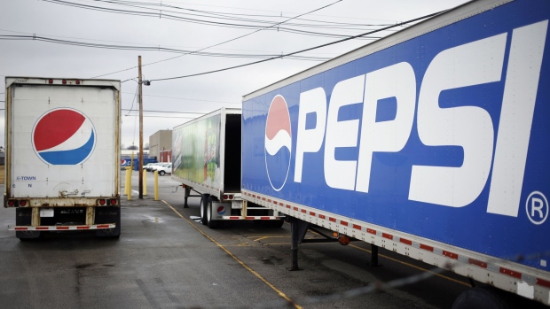 Delivery trucks sit parked outside the Pepsi Beverages Co. plant in Louisville, Kentucky, U.S., on Sunday, Feb. 11, 2018. PepsiCo Inc. is scheduled to release earnings figures on February 13. Photographer: Luke Sharrett/Bloomberg