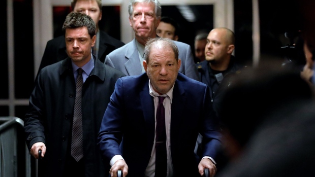 Harvey Weinstein, former co-chairman of the Weinstein Co., center, departs from state supreme court in New York, U.S., on Monday, Jan. 27, 2020. Weinstein, who is charged with rape and predatory sexual assault, is accused of raping a woman in a Manhattan hotel room in 2013 and performing a forcible sex act on another in 2006 in his SoHo apartment. If convicted, he could get life in prison. Photographer: Peter Foley/Bloomberg