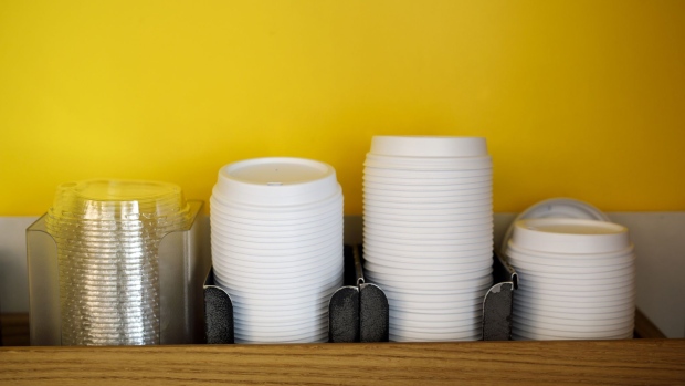 Coffee cup lids sit stacked at a cafe in Toronto, Ontario, Canada, on Wednesday, June 12, 2019. Justin Trudeau's government announced plans Monday to ban single-use plastics such as straws and plates in Canada. Photographer: Cole Burston/Bloomberg