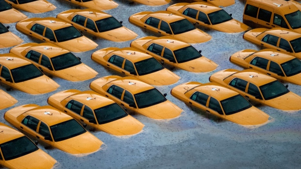 HOBOKEN, NJ - OCTOBER 30: Taxis sit in a flooded lot after Hurricane Sandy October 30, 2012 in Hoboken, New Jersey.?The storm has claimed at least 40 lives in the United States and has caused massive flooding across much of the Atlantic seaboard. U.S. President Barack Obama has declared the situation a 'major disaster' for large areas of the U.S. east coast, including New York City, with widespread power outages and significant flooding in parts of the city. (Photo by Michael Bocchieri/Getty Images)