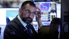 Trader Aman Patel works on the floor of the New York Stock Exchange, Tuesday, Feb. 25, 2020. AP