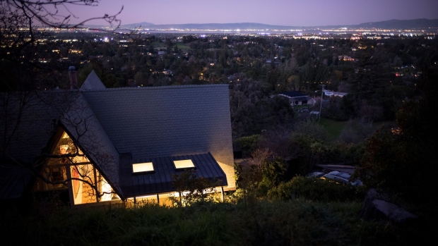 A homes stands at dusk in Los Altos Hills, California, U.S., on Monday, Feb. 10, 2020. The richest communities in the U.S. continue to get richer. This year, in order to make the top 100, a neighborhood needed an average household income of $220,000 -- up from $209,000 last year. Photographer: David Paul Morris/Bloomberg