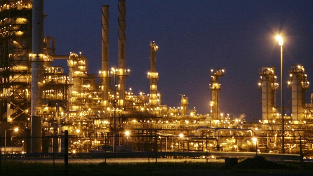A night view of Ameriven oil refinery, one of the four companies at the Jose Complex in Anzoategui state, 200 miles East from Caracas, Venezuela, on Thursday, Sept. 13, 2007. Photographer: DIEGO GIUDICE/Bloomberg