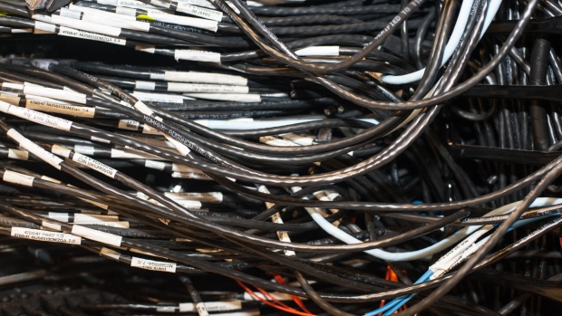 Cables are seen on a server at the Iron Mountain Inc. data storage facility in Boyers, Pennsylvania, U.S., on Tuesday, Feb. 13, 2018. The underground data center, located in a former limestone mine, stores 200 acres of physical data for many clients including the federal government. Photographer: Stephanie Strasburg/Bloomberg