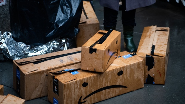 Satirical shipping boxes sit outside the penthouse of Jeff Bezos, founder and chief executive officer of Amazon.Com Inc., during a protest against Amazon in New York, U.S., on Monday, Dec. 2, 2019. The optics war between Amazon.com Inc. and its critics is intensifying on Cyber Monday with labor, environmental and digital privacy groups staging events around the globe to amplify their concerns about the world's biggest online retailer. Photographer: Mark Kauzlarich/Bloomberg