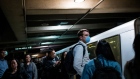 A person wearing a protective mask waits for a Bay Area Rapid Transit (BART) train in San Francisco, California, U.S., on Thursday, Feb. 27, 2020. California is monitoring 8,400 people for signs of the virus after they traveled to Asia. The virus has spread “very slowly” in the U.S., President Donald Trump said in a tweet. Photographer: David Paul Morris/Bloomberg
