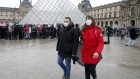 PARIS, FRANCE - MARCH 02: Tourists wearing protective masks walk past the Louvre Museum as the museum was closed for a staff meeting about the coronavirus outbreak on March 2, 2020 in Paris, France. Due to a sharp increase in the number of cases of coronavirus declared in Paris and throughout France, several sporting, cultural and festive events have been postponed or cancelled. The epidemic has exceeded 3,000 dead for more than 86,000 infections in 60 countries. In France, 130 cases are now confirmed, in 12 regions in total. (Photo by Chesnot/Getty Images) Photographer: Chesnot/Getty Images Europe