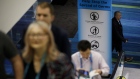 A "Help Stop The Spread Of Germs" sign is displayed next to an escalator during the Prospectors & Developers Association of Canada (PDAC) conference in Toronto, Ontario, Canada, on Monday, March 2, 2020. While other big conferences have been canceled, including the CERAWEEK summit in Houston which was due to start on March 9, miners declared last week that the show would go on despite the coronavirus -- with vigorous sanitation protocols in place.