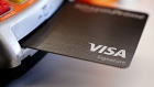 A Visa Inc. credit card is arranged for a photograph in Tiskilwa, Illinois, U.S., on Tuesday, Sept. 18, 2018. 