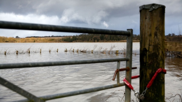 Flood water covers farmland in Cressage, U.K., Feb. 29. Photographer: Paul Thomas/Bloomberg