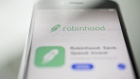 The Robinhood application is displayed in the App Store on an Apple Inc. iPhone in an arranged photograph taken in Washington, D.C., U.S., on Friday, Dec. 14, 2018. The Securities Investor Protection Corp. said a new checking account from Robinhood Financial LLC raises red flags and that the deposited funds may not be eligible for protection. Photographer: Andrew Harrer/Bloomberg