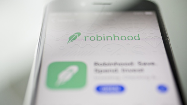 The Robinhood application is displayed in the App Store on an Apple Inc. iPhone in an arranged photograph taken in Washington, D.C., U.S., on Friday, Dec. 14, 2018. The Securities Investor Protection Corp. said a new checking account from Robinhood Financial LLC raises red flags and that the deposited funds may not be eligible for protection. Photographer: Andrew Harrer/Bloomberg