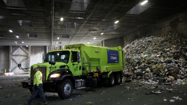 A GFL Environmental Inc. garbage truck prepares to drop off a load of waste at a transfer station in Toronto, Ontario, Canada, on Thursday, Oct. 24, 2019. GFL, North America's fourth-largest waste hauler by revenue, seeks to raise as much as $2.1 billion in what would be the largest initial public offering in Canada since 2004. Photographer: Cole Burston/Bloomberg