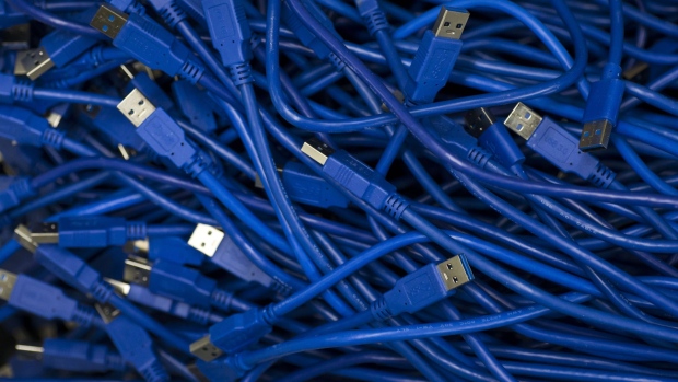 USB cables are seen inside the DMM Mining Farm, operated by DMM.com Co., in Kanazawa, Japan, on Tuesday, March 20, 2018. Japan is moving toward legalizing initial coin offerings, even as countries such as China and the U.S. restrict the fundraising technique because of their risks for investors. A government-backed study group laid out basic guidelines for further adoption of ICOs, according to a report published on April 5. Photographer: Tomohiro Ohsumi/Bloomberg