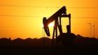 A pumpjack sits on the outskirts of town at dawn in the Permian Basin oil field on January 21, 2016