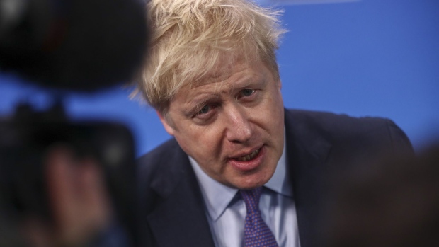 Boris Johnson, U.K. prime minister, speaks to the media as he arrives for a North Atlantic Treaty Organisation (NATO) Leaders' meeting at the Grove Hotel near Watford, U.K., on Wednesday, Dec. 4, 2019.