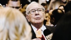 Warren Buffett, chairman and chief executive officer of Berkshire Hathaway Inc., eats a Dairy Queen vanilla orange ice cream bar while touring the shopping floor ahead of the company's annual meeting in Omaha, Nebraska, U.S., on Saturday, May 4, 2019. 