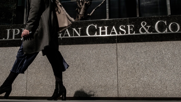 Pedestrians pass in front of a JPMorgan Chase & Co. office building in New York. 