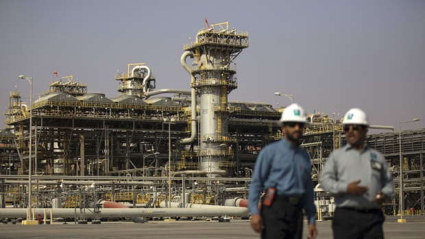 Employees visit the Natural Gas Liquids facility in Saudi Aramco's Shaybah oilfield in the Rub' Al-Khali (Empty Quarter) desert in Shaybah, Saudi Arabia. 