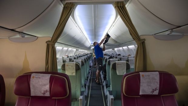 IN FLIGHT - MARCH 04: A near-empty Myanmar National airlines flight from Yangon to Suvarnabhumi International airport on March 04, 2020 in flight.