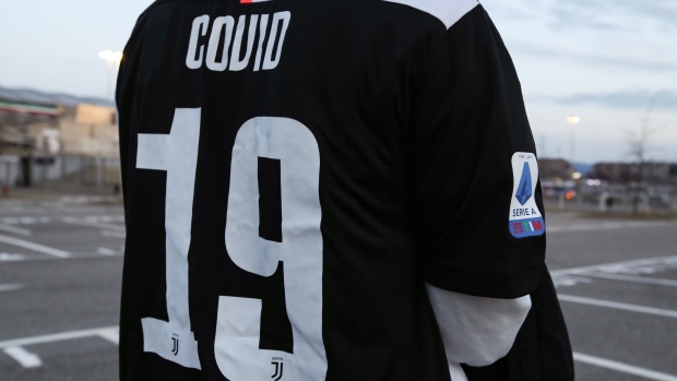 TURIN, ITALY - MARCH 08: A youth pictured wearing a Juventus jersey bearing the name Covid 19 the official name for the Coronavirus disease before the Serie A match between Juventus and FC Internazionale at Allianz Stadium on March 08, 2020 in Turin, Italy. (Photo by Jonathan Moscrop/Getty Images)