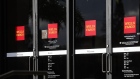 Signage is displayed on the doors of a Wells Fargo & Co. bank branch in St. Petersburg, Florida, U.S., on Monday, Jan. 14, 2019. Wells Fargo & Co. is scheduled to release earnings figures on January 15. Photographer: Eve Edelheit/Bloomberg