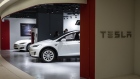A Tesla Inc. Model S, left, and Model X electric vehicles sit on display at a showroom in Hong Kong, China